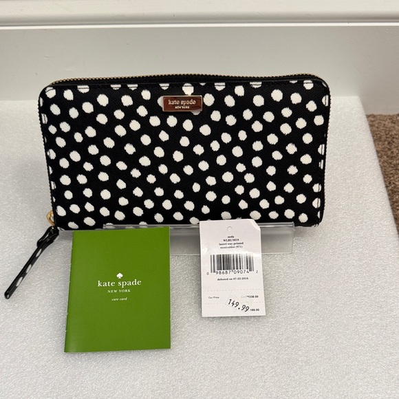 kate spade Handbags - kate spade neda black and white laurel way printed musical dot wristlet NWT